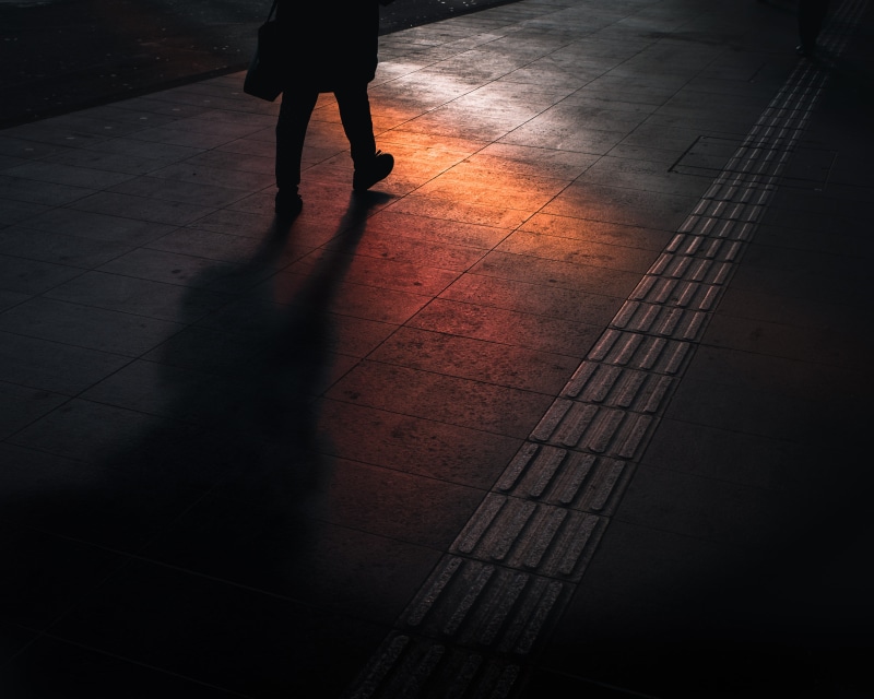 lifestyles, low section, gray, people, floor, reflection, city, leisure activities, colour, sidewalk, footpath, dark, human leg, shadow, human foot, tile