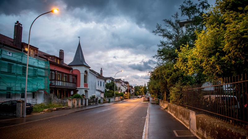 trees, plant, sidewalks, road, no people, sky, pavement, nature, tree, built structure, city, gray, building exterior, cloud - sky, direction, transportation