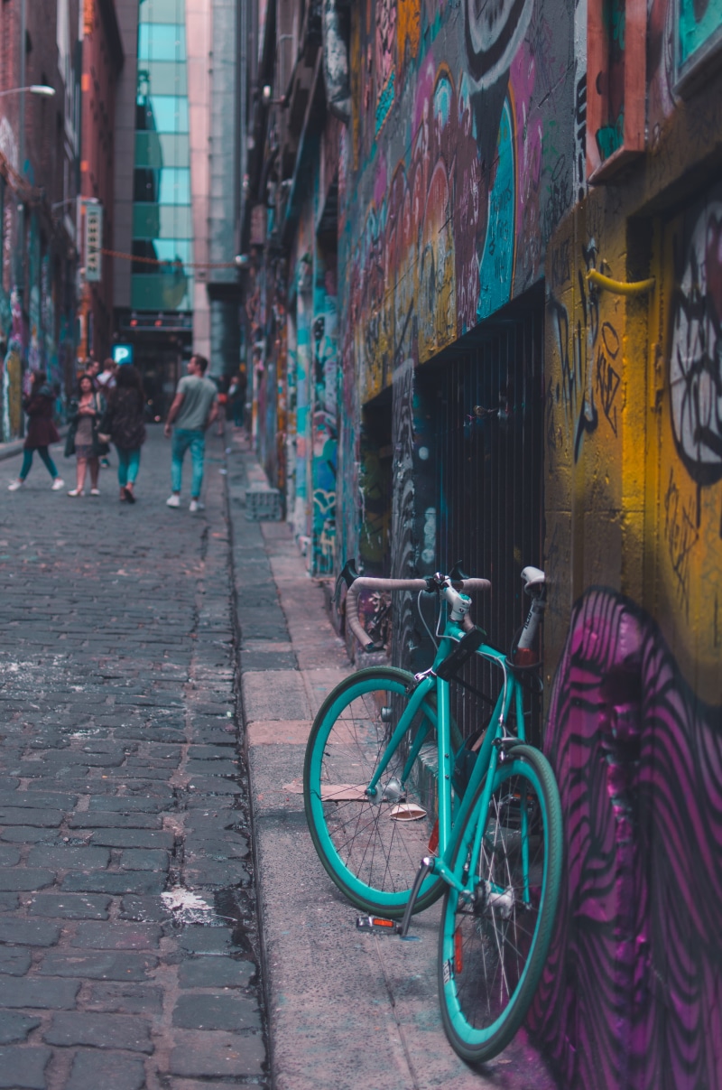 building, artworks, bike, lane, building exterior, cobble, stone, transportation, incidental people, built structure, wall - building feature, art, footpath