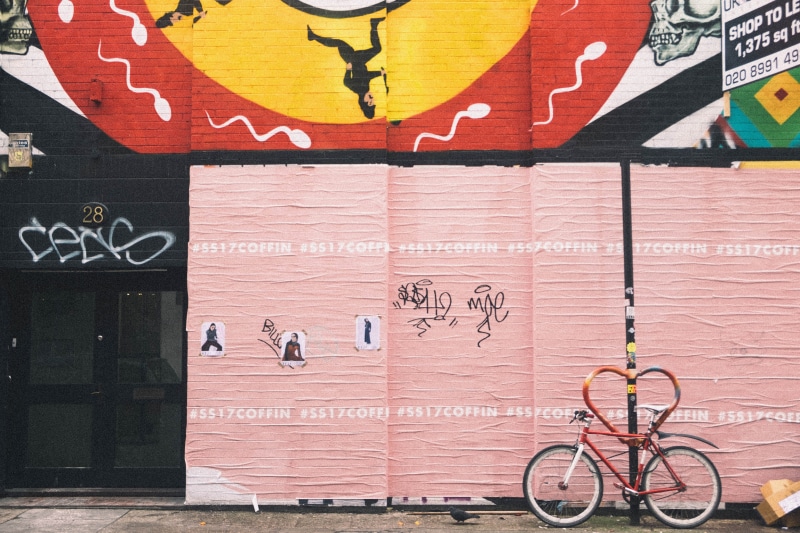 street art, painted, sperm, white, beige, no people, vandalism, wall, lock, transportation, art and craft, wall - building feature, city life, day, lampost