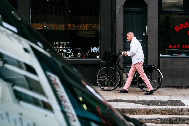 city, street photography, men, walking, window, business, people, street, cycling, adult, concrete, males, commuter, storefront, transportation, mode of Transport