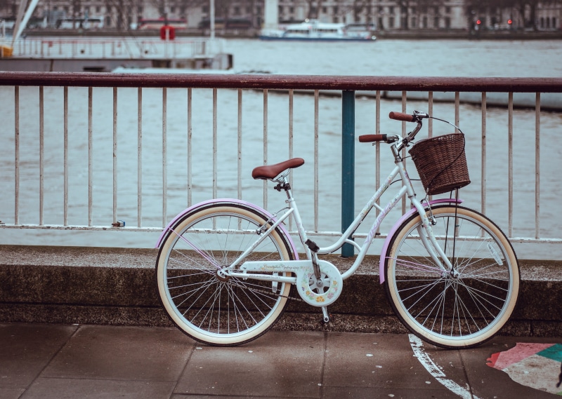 mode of transport, bike, lock, outdoors, white, near, day, architecture, sidewalk, street, building exterior, mode of transportation, bridge, basket, canal