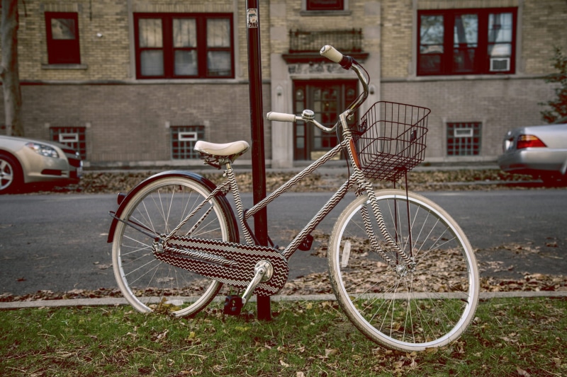 bicycle basket, commuter, near, daytime, architecture, basket, built structure, city, no people, fall, mode of transportation, grass, stationary, hipster