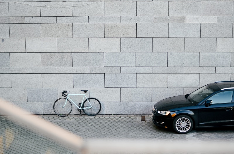 leaning, motor vehicle, city, brick, transportation, car and bike, architecture, sport, kiev, parking, outdoors, no people, garage, wall - building feature