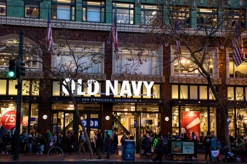 sign, real people, light, large group of people, store, navy, storefront, illuminated, architecture, mode of transportation, city, building exterior, transportation