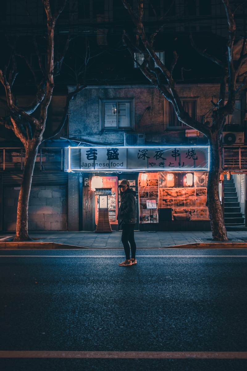 architecture, walking, full length, real people, mode of transportation, city, road, transportation, storefront, men, lifestyles, woman, rear view, illuminated