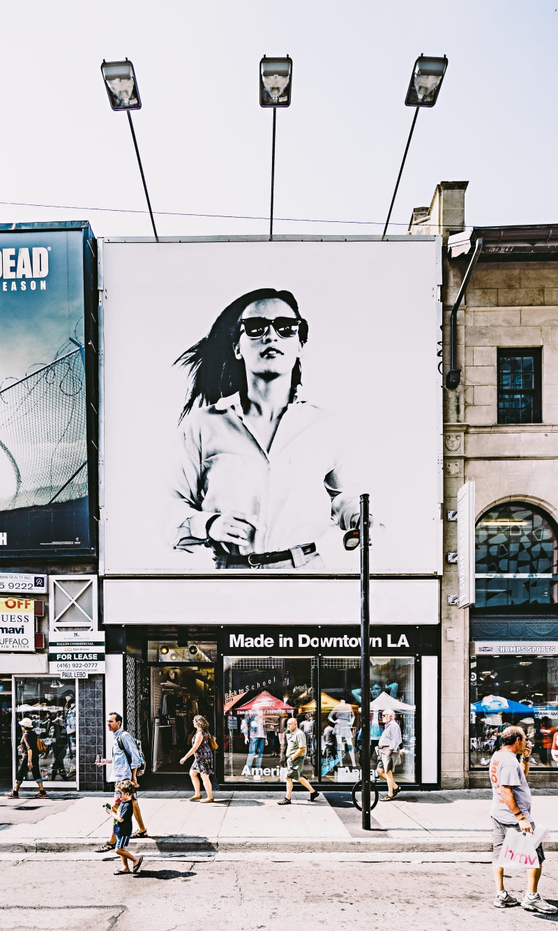 young adult, lifestyles, leisure activity, art and craft, signage, building exterior, storefront, outdoors, near, architecture, road, buildings, shop window