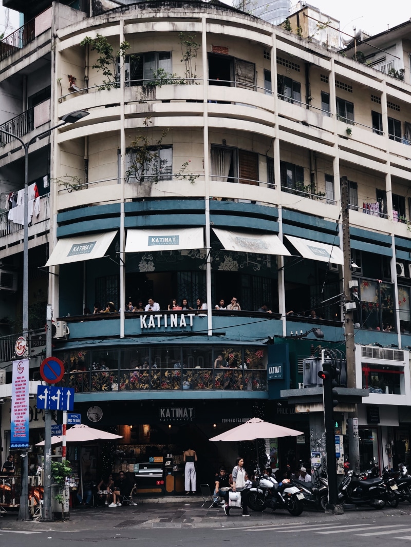 communication, mode of transportation, building, building exterior, transportation, street, window, outdoors, road, script, built structure, incidental people