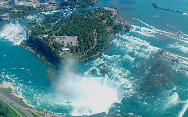 water, motion, coastline, beauty in nature, flowing, high angle view, waterfall, beach, aerial, scenics - nature, outdoors, travel destinations, day, photo