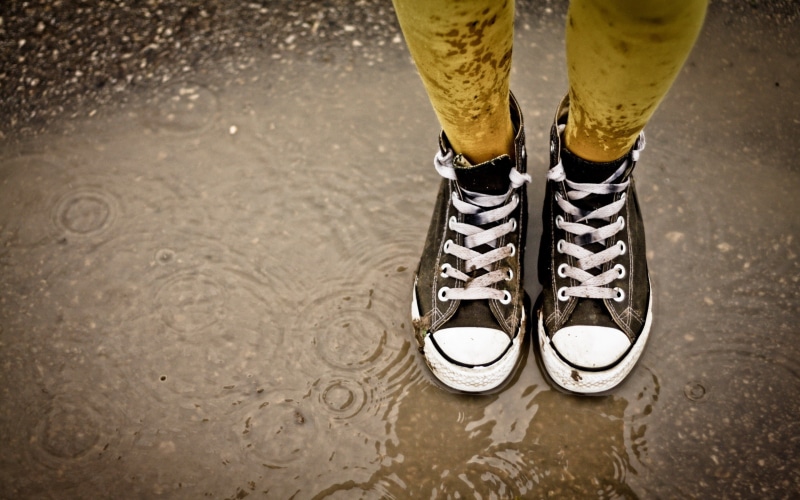 outdoors, human body part, ripples, shoes, rubber boot, Converse, one person, human leg, day, body part, low section, adult, limb, puddle, human foot, nature