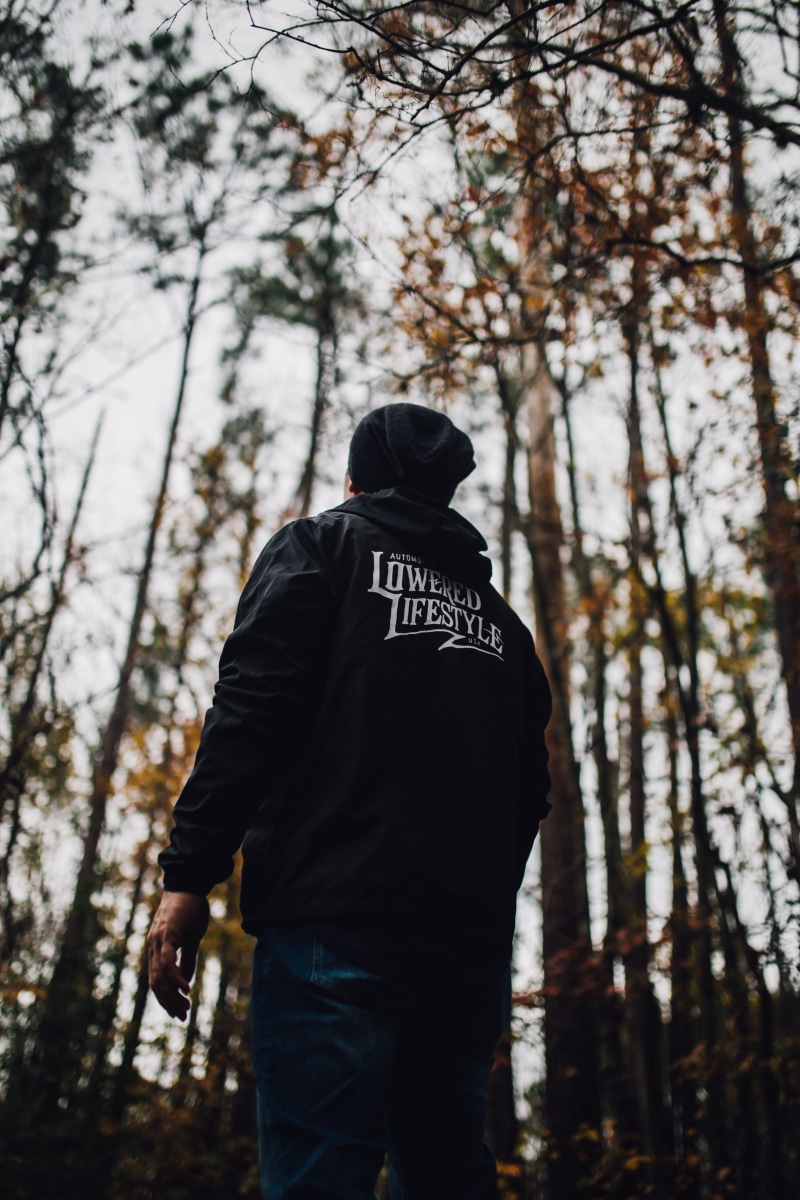 plant, three quarter length, fall, standing, casual clothing, apparel, wearing, sweater, blue, jacket, human, trees, real people, beanie, focus on foreground