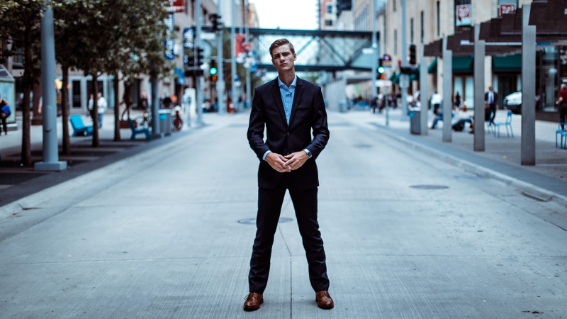 portrait, middle, jacket, casual clothing, well-dressed, building, focus on foreground, pillar, lifestyles, one person, young men, street, front view, full length