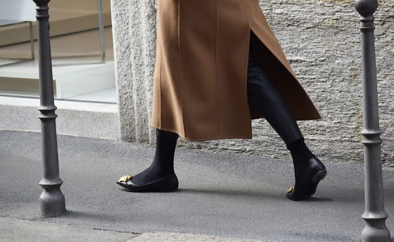 shoe, wedge, human leg, women, standing, trench coat, outdoors, promontory, footwear, city, lifestyles, clogs, high heel, coat, woman, day, pair, clothing