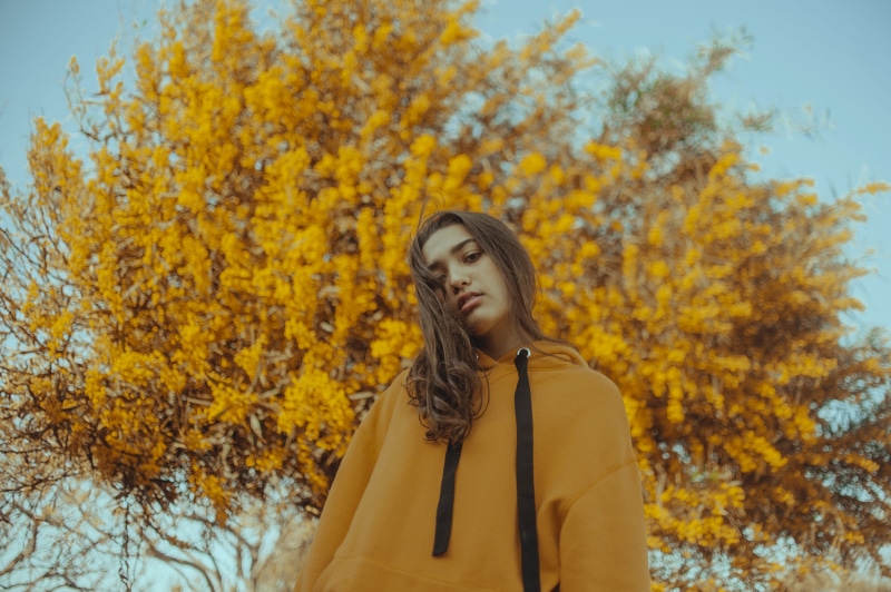 yellow, young adult, fashion, 2K, beauty, change, woman, lifestyles, sleeve, front view, day, standing, flower, hairstyle, autumn, coat, raincoat, leaf