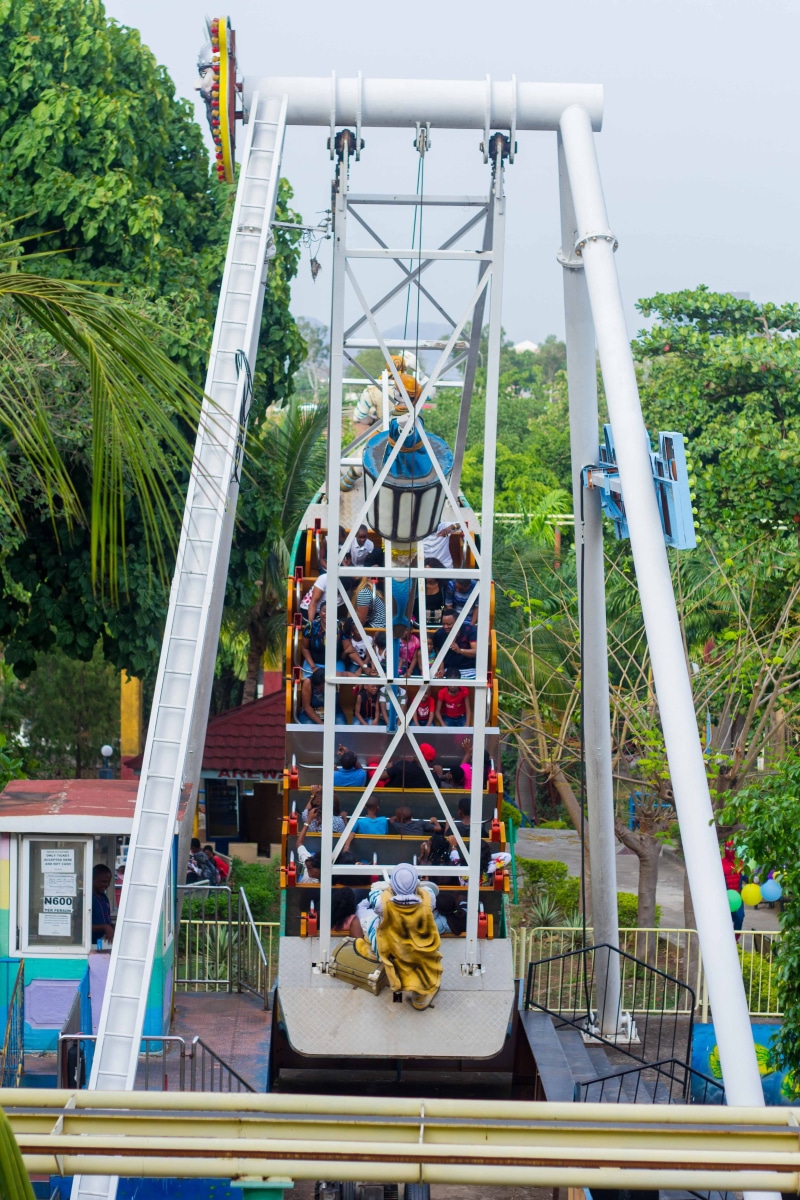 building exterior, amusement park, person, outdoors, architecture, bungee, outdoor play area, cable, built structure, ferris wheel, 5K, rollercoaster