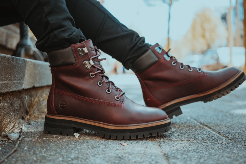 helmet, footwear, focus on foreground, adventure, timberland, men, outdoors, human foot, puddle, work, lifestyles, leisure activity, low section, leather