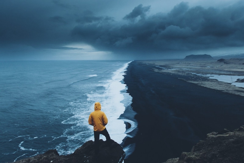 yellow, nature, holiday, scenics - nature, coast, land, leisure activity, rock - object, cloud - sky, water, horizon over water, hoodie, one person, vacations