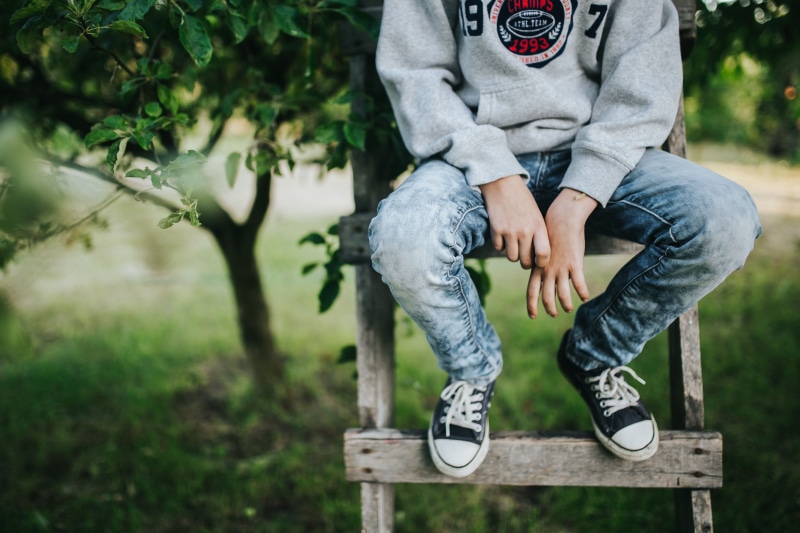outdoors, shoe, tree, nature, teenager, focus on foreground, front view, jeans, people, boys, teen, low section, leisure activity, one Person, teenage