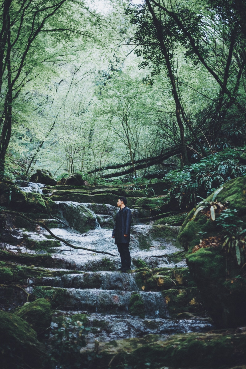 scenics - nature, men, raincoat, surrounded, walking, lifestyles, full length, rocks, leisure activity, dress pants, pants, plant, dress, trees, people