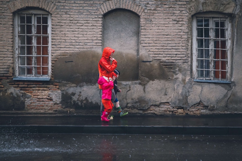 innocence, full length, day, architecture, wall, building exterior, windows, street, kids, lifestyles, outdoors, child, standing, casual clothing, people