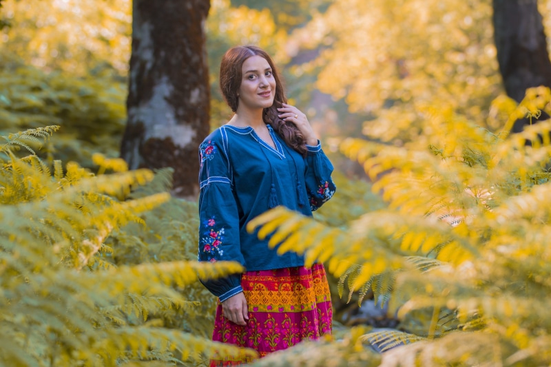 standing, women, forest, travel, raincoat, happiness, smiling, long sleeve, tree, leaf, yellow, guilan, nature, plant, sleeve, emotion, hairstyle, human