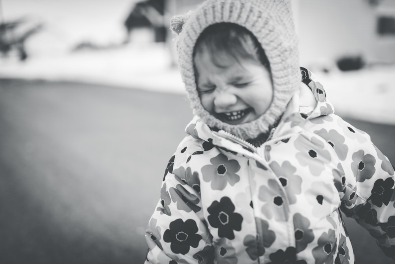 child, toddler, raincoat, warm clothing, portrait, human, winter, happiness, black and white, clothing, apparel, hoodie, outdoors, face, smiling, bonnet