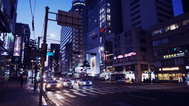 sign, building exterior, skyscraper, zebra crossing, road marking, namsan tower, low, night, light, street, city life, car, buildings, road, city, modern