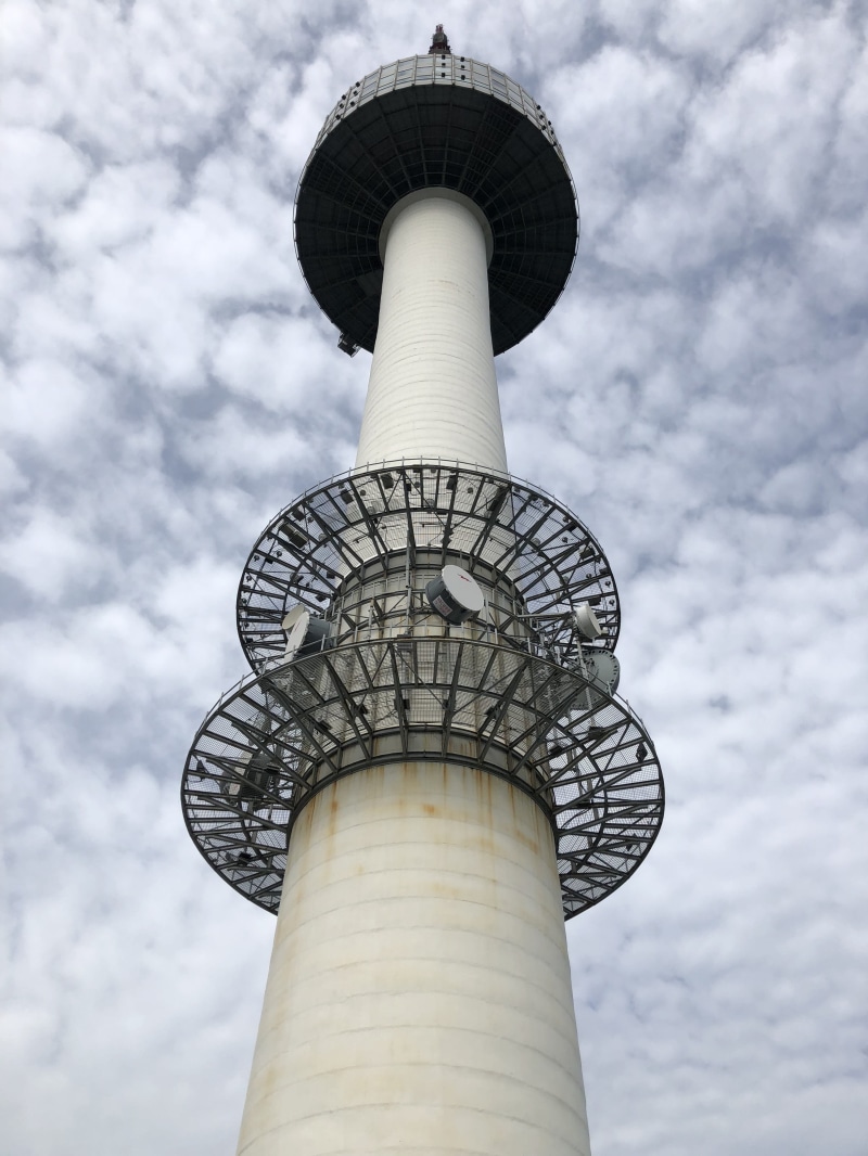 city, outdoors, cloud, cloud - sky, namsan tower, water conservation, building exterior, water tower - storage tank, day, low angle view, travel, global communications