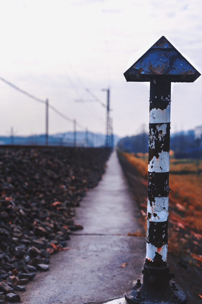 day, communication, symbol, connection, rail, focus on foreground, boundary, train, barrier, bolster, gravel, nature, safety, security, direction, no people