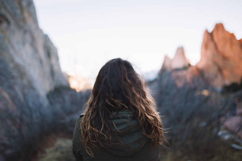 daytime, color Image, rock - Object, natural Phenomenon, human Age, one woman only, trip, image Type, mountain, women, land Feature, leather, adult, hair