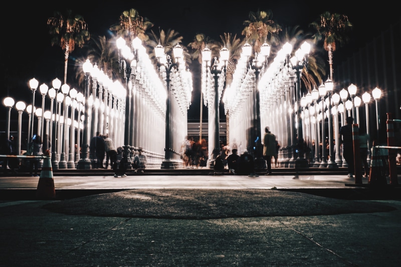 urban, lapse, city, person, night, light, building exterior, in a row, street light, incidental people, building, outdoors, lights, time, sitting, tree