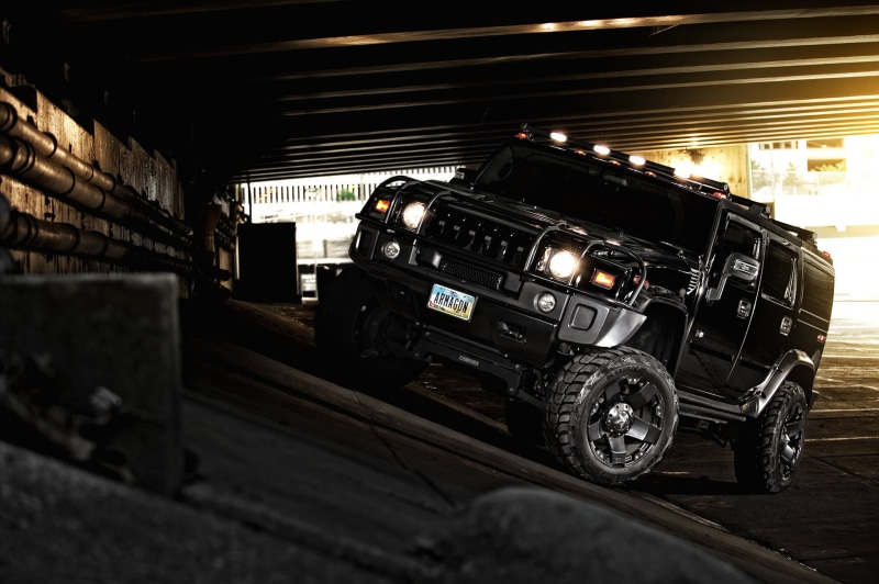 indoors, stationary, black, tire, industry, large group of objects, 1080P, headlight, off-Road Vehicle, built structure, black Color, hummer, garage, architecture
