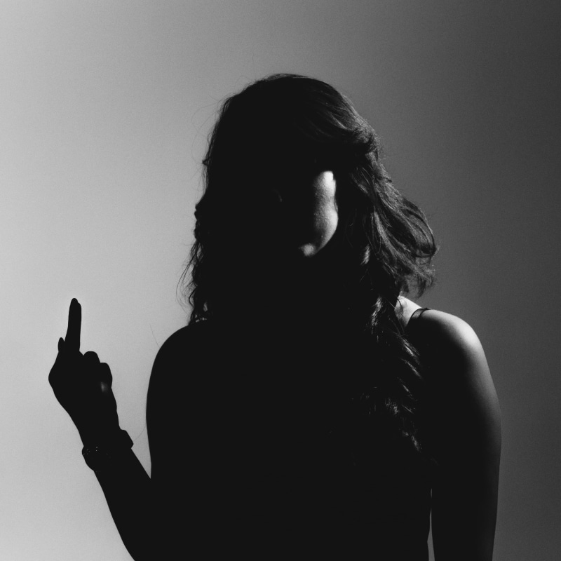 model, front view, shadows, middlefinger, hairstyle, headshot, women, waist up, curles, studio, hair, studio shot, girl, middle finger, lifestyles, indoors