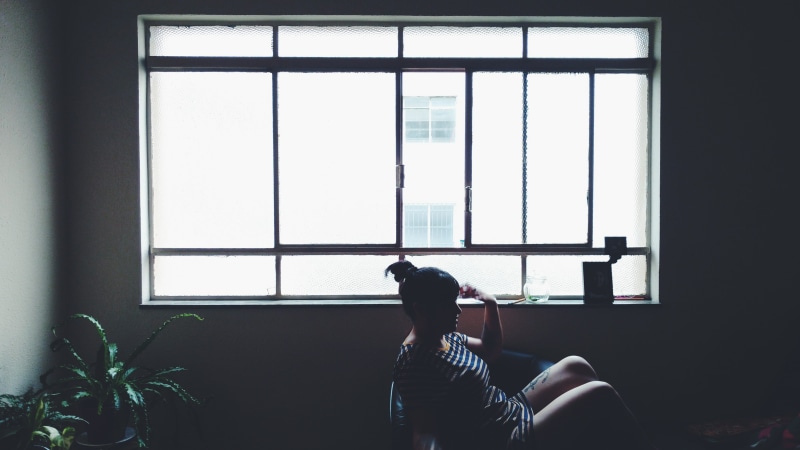 woman, glass, three quarter length, white, sitting, 5K, beside, furniture, wearing, architecture, lifestyles, shadow, one young man only, indoors, depression - sadness