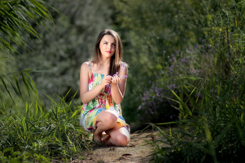 women, kneeling, young adult, hair, teenager, sitting, looking at camera, outdoors, clothing, woman, dress, hairstyle, near, grasses, summer, plant, brown hair