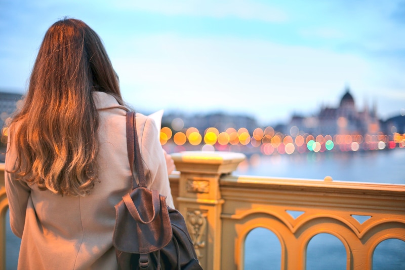 budapest, illuminated, leather, hair, view, coat, adult, bag, woman, built structure, people, city, travel destinations, behind, parliament, 2K, waist up