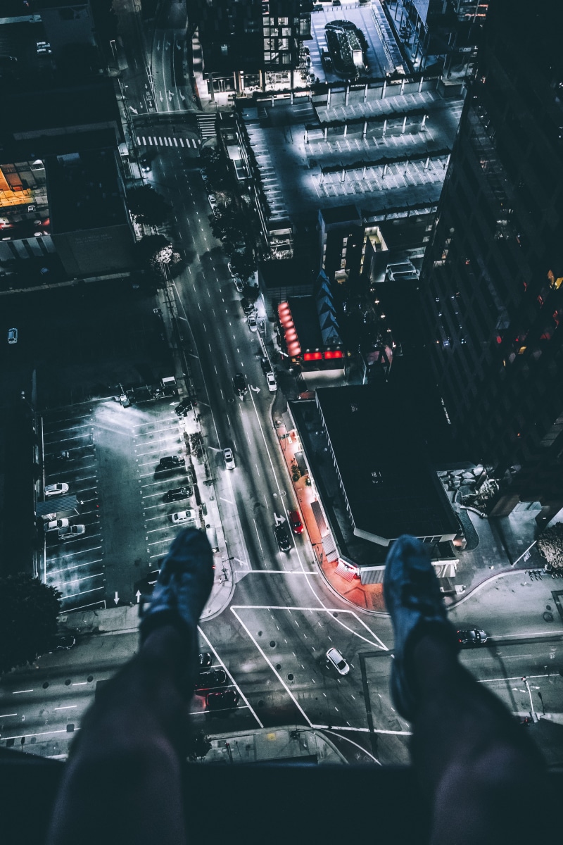 person, people, lifestyles, motor vehicle, top, sitting, land vehicle, 5K, time, illuminated, night, city Life, men, repairing, cityscape, leg, real people
