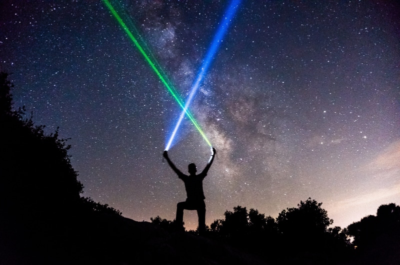 astronomy, sky, scenics - nature, galaxy, beauty in nature, silhouette, human body part, lightsabers, one person, wielding, leisure activity, human arm