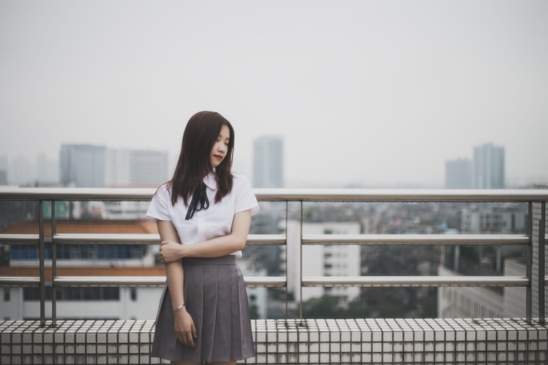 5K, three quarter length, young Women, building exterior, people, blouse, focus on foreground, sky, standing, day, beautiful woman, railing, contemplation