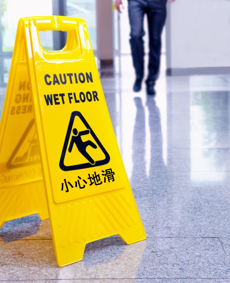 only men, human leg, slippery, body part, safety, motion, yellow, low section, incidental people, text, script, slippery floor, people, 2K, western script