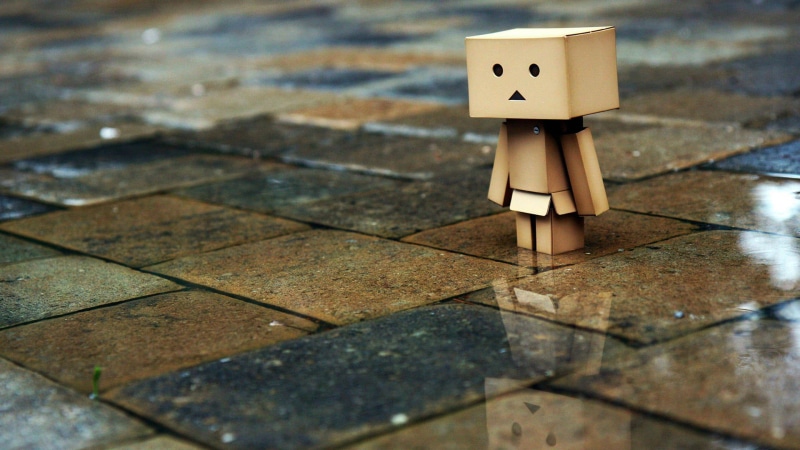 black, nature, symbol, outdoors, robot, 3d, tiled floor, cardboard, tile, still life, water, no people, focus on foreground, high angle view, life, wet