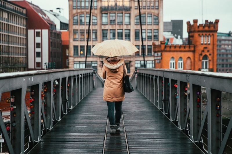 bridge, full length, sky, building exterior, buildings, young, clothing, boots, rear view, weather, bag, cloudy, woman, jeans, backside, iron, built structure