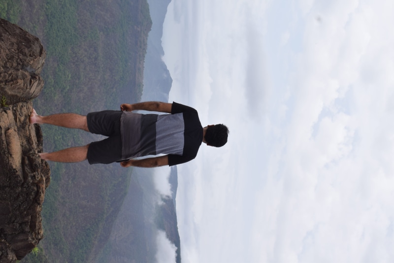 water, one person, backpacker, outdoors, trek, looking at view, vacations, lifestyles, machiprabal, sky, casual clothing, cloud - sky, leisure activity