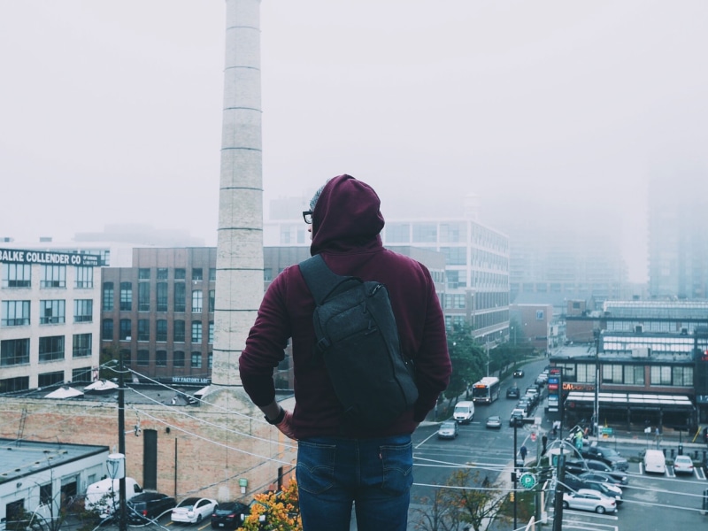 lifestyles, 1080P, office building exterior, day, leisure activity, only men, hoodie, tall - high, one man only, urban, architecture, facing, nature, travel