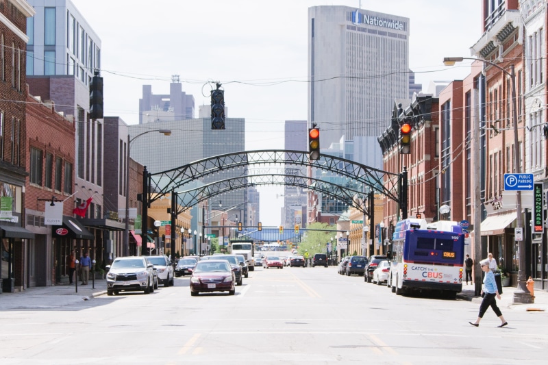 sign, columbus, city life, shopfronts, downtown, ohio, street, traffic, real people, office building exterior, streetview, built structure, bus, land vehicle