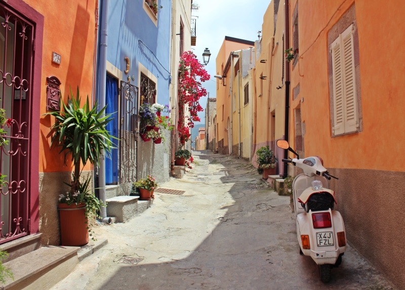architecture, street, motor, 4K, outdoors, sunlight, plant, day, potted plant, mode of transportation, direction, scooter, transportation, ay, alley, the way forward