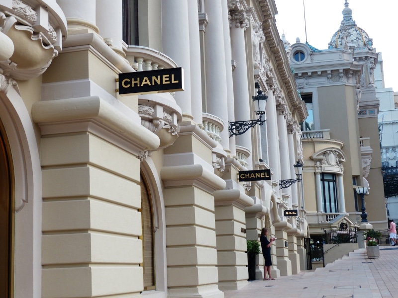 day, city, near, building exterior, communication, standing, outdoors, load line, 4K, wealth, architectural column, real people, chanel, advertising sign