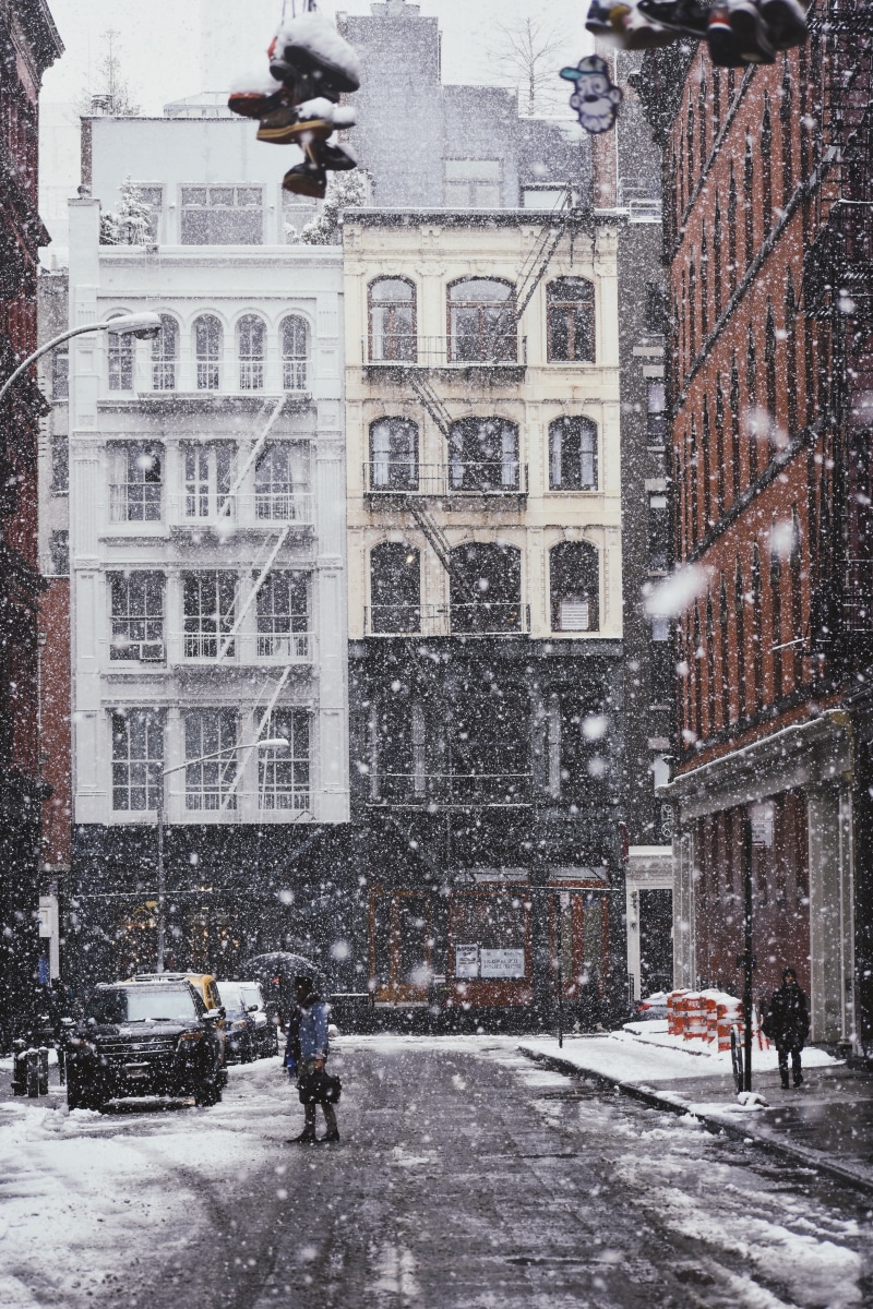 transportation, soho, buildings, umbrella, motor vehicle, day, snow, cold, extreme weather, mode of transportation, new york city, new york, city, people