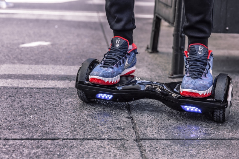 sport, body part, low section, people, one person, day, shoes, objects, black, lifestyles, outdoors, hover, balancing, 5K, asphalt, hip, speed, urban Scene