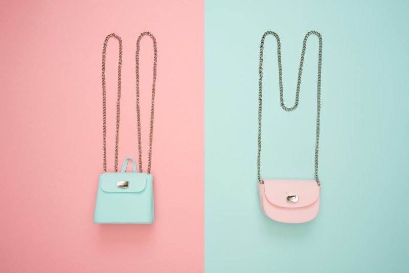 hanging, indoors, colored background, blue, 5K, studio shot, purses, pink, safety, no people, close-up, power supply, personal accessory, metal, electricity